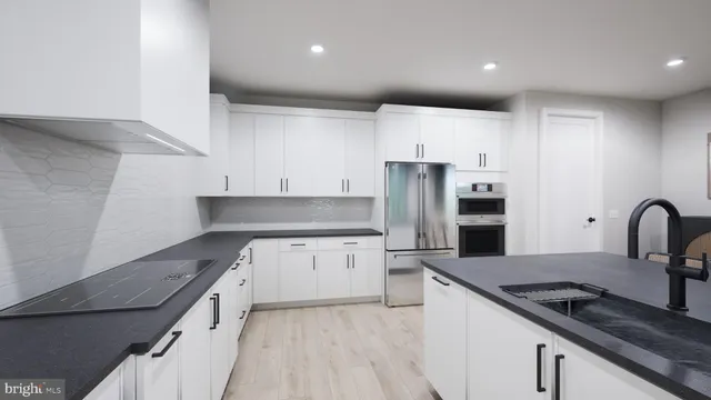 a en suite bathroom with a sink and mirror