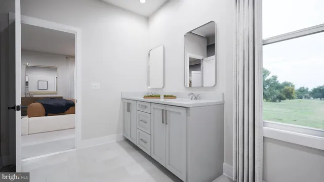 a bathroom with a double vanity sink mirror and bathtub
