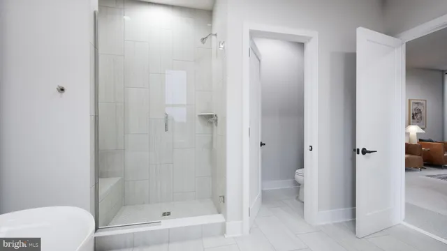 a picture of a bathroom with a shower