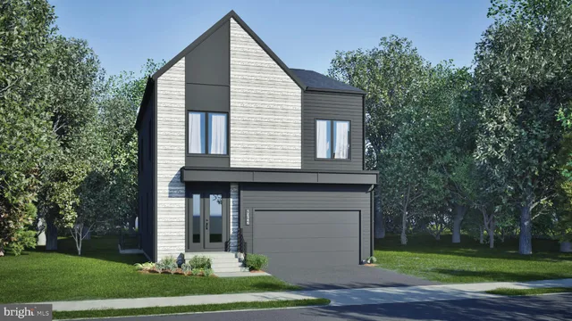 a view of a house with a yard and large tree