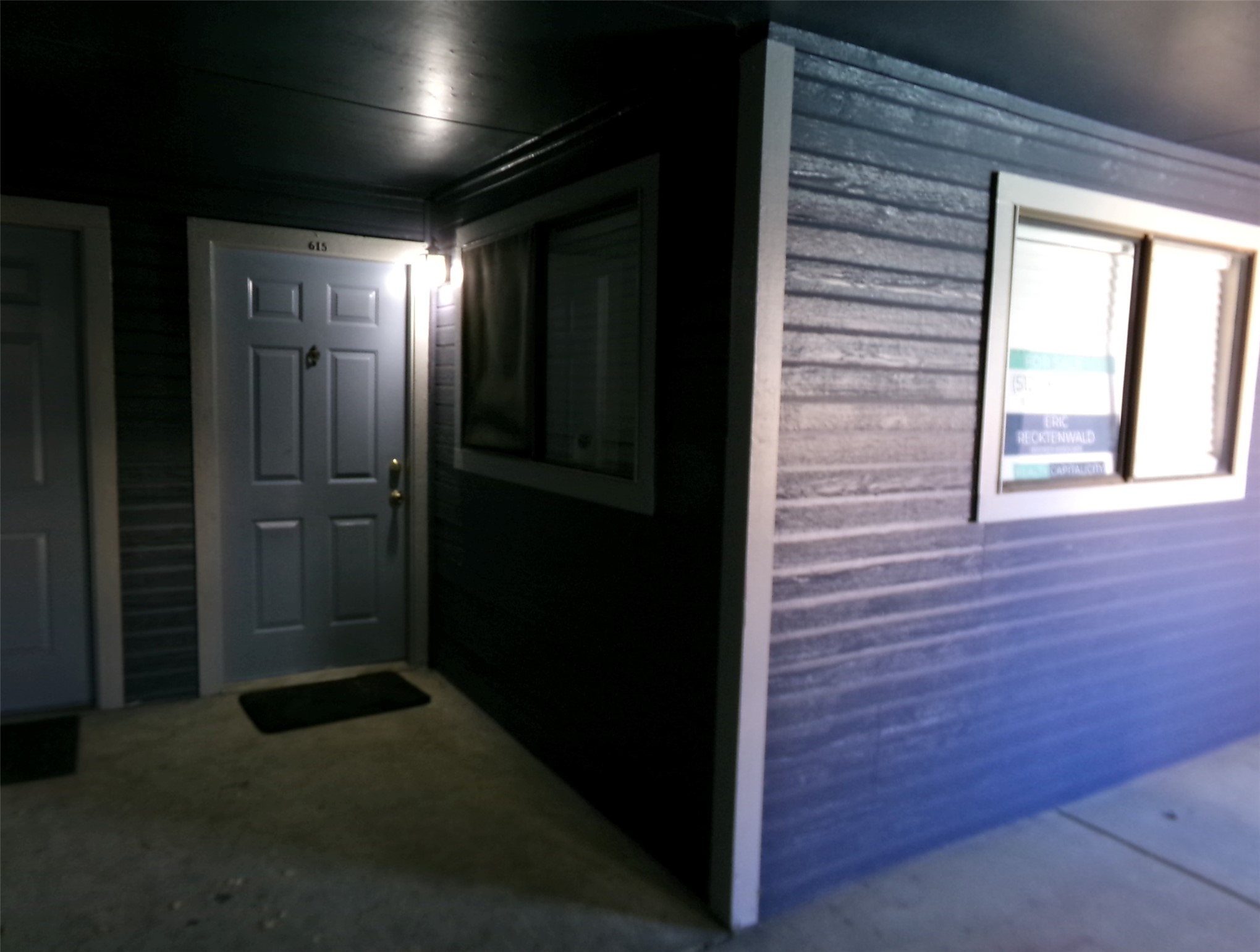 2500 Burleson Road, Unit 615 Austin, TX 78741 - Photo 3 of 13 a view of hallway with a door and wooden floor
