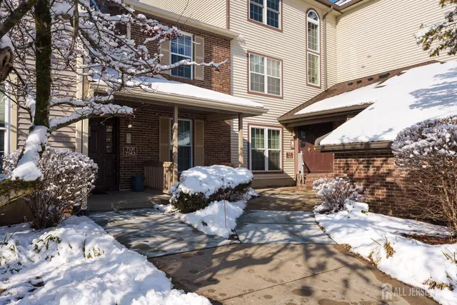 a view of a chairs and a table in the patio