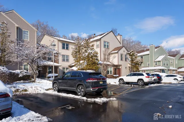 a view of a cars park in front of a building