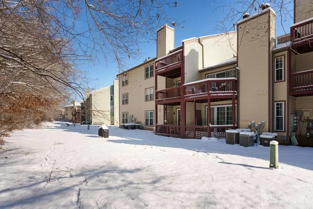 a view of a street with chairs