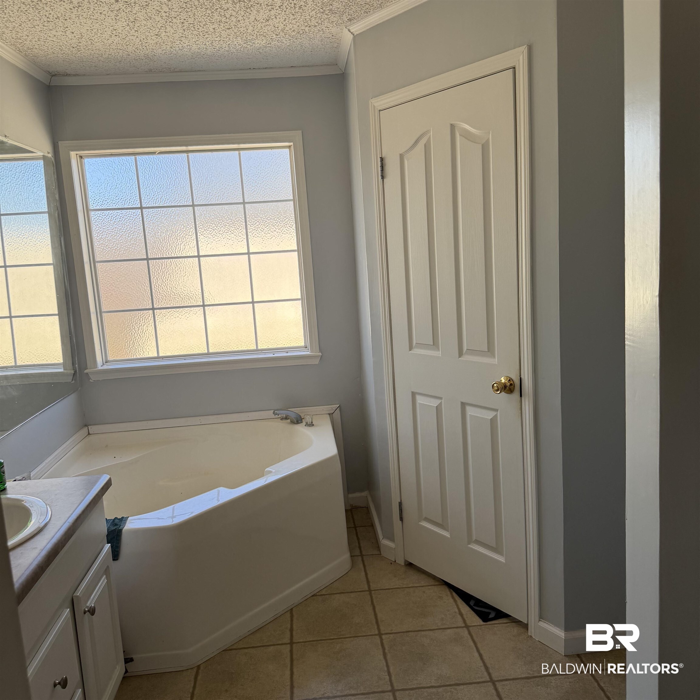447 Sugar Hill Road Monroeville, AL 36460 - Photo 19 of 27 Full bathroom with a bath, vanity, and light tile patterned floors