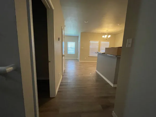 a view of a hallway with a room