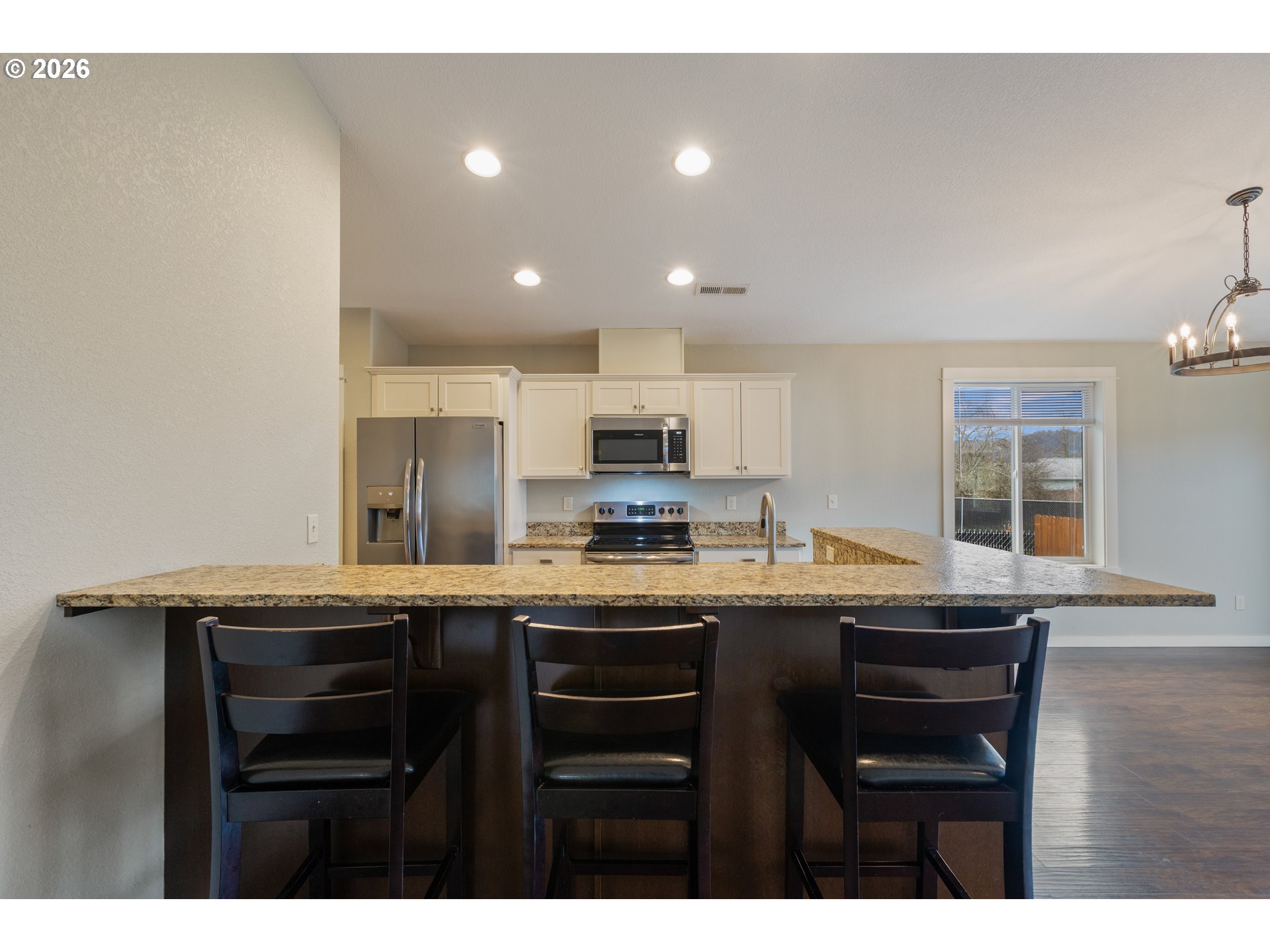 409 South State Street Sutherlin, OR 97479 - Photo 15 of 47 a kitchen with stainless steel appliances granite countertop a sink and cabinets