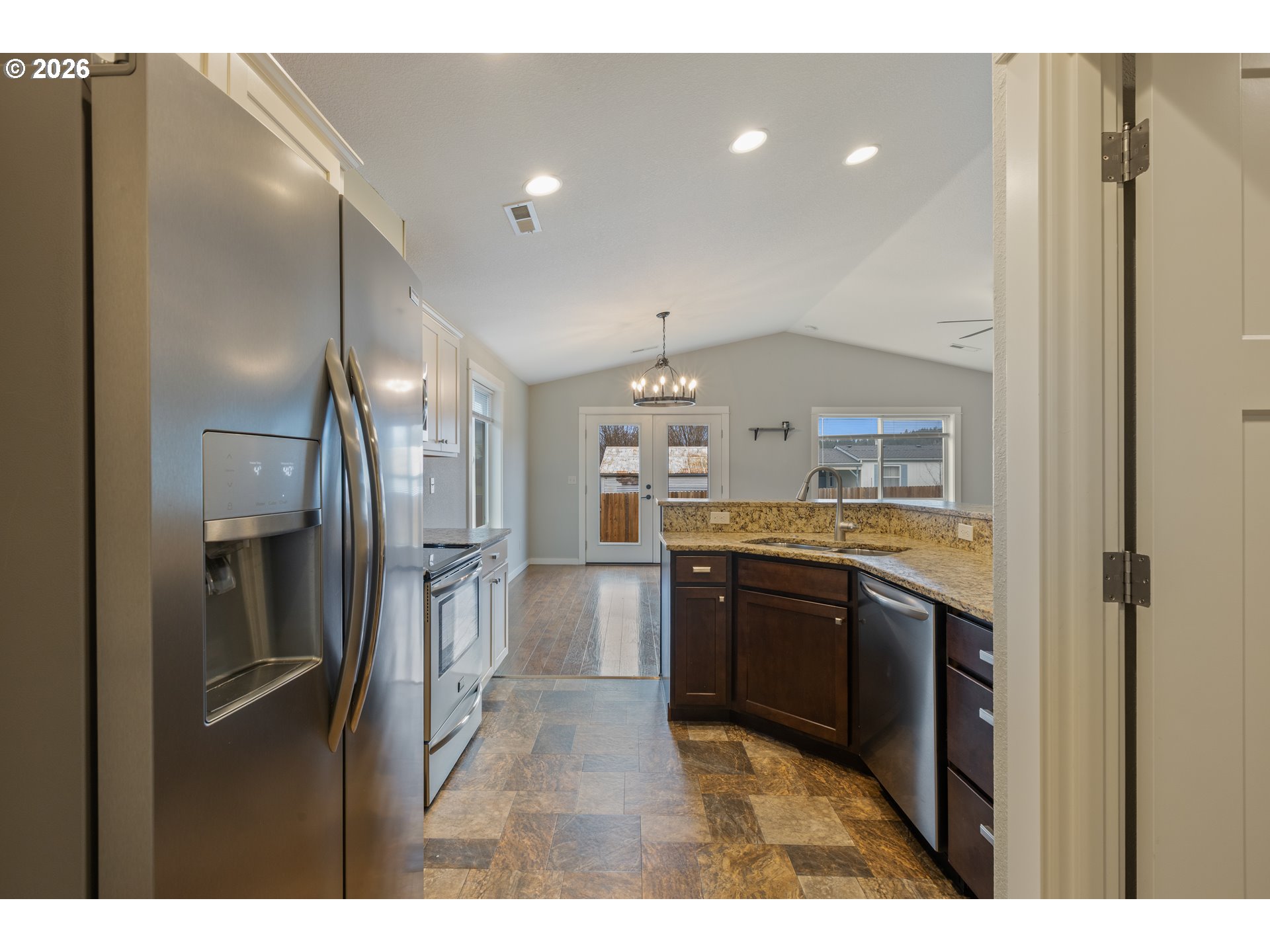 409 South State Street Sutherlin, OR 97479 - Photo 18 of 47 a kitchen with stainless steel appliances granite countertop a refrigerator and a sink
