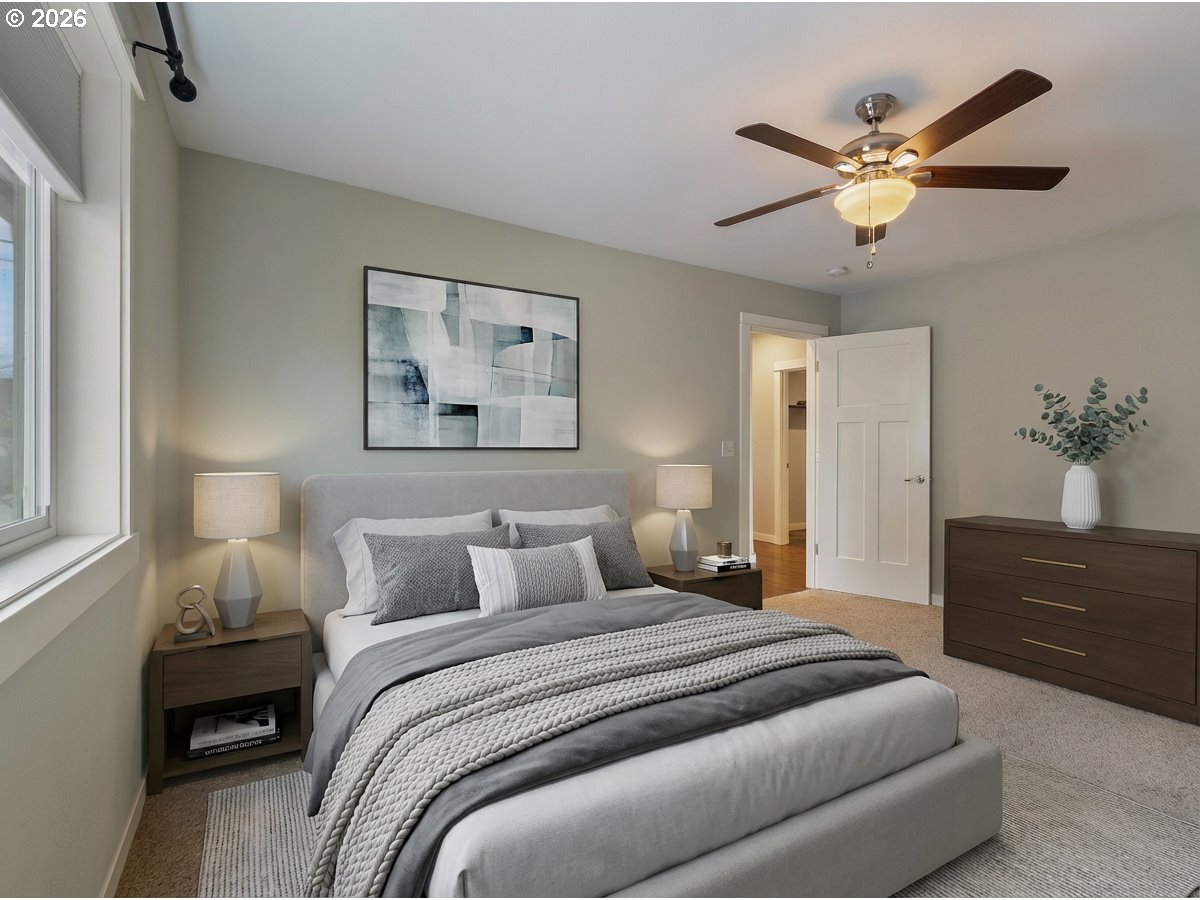 409 South State Street Sutherlin, OR 97479 - Photo 23 of 47 a bedroom with a large bed and a chandelier