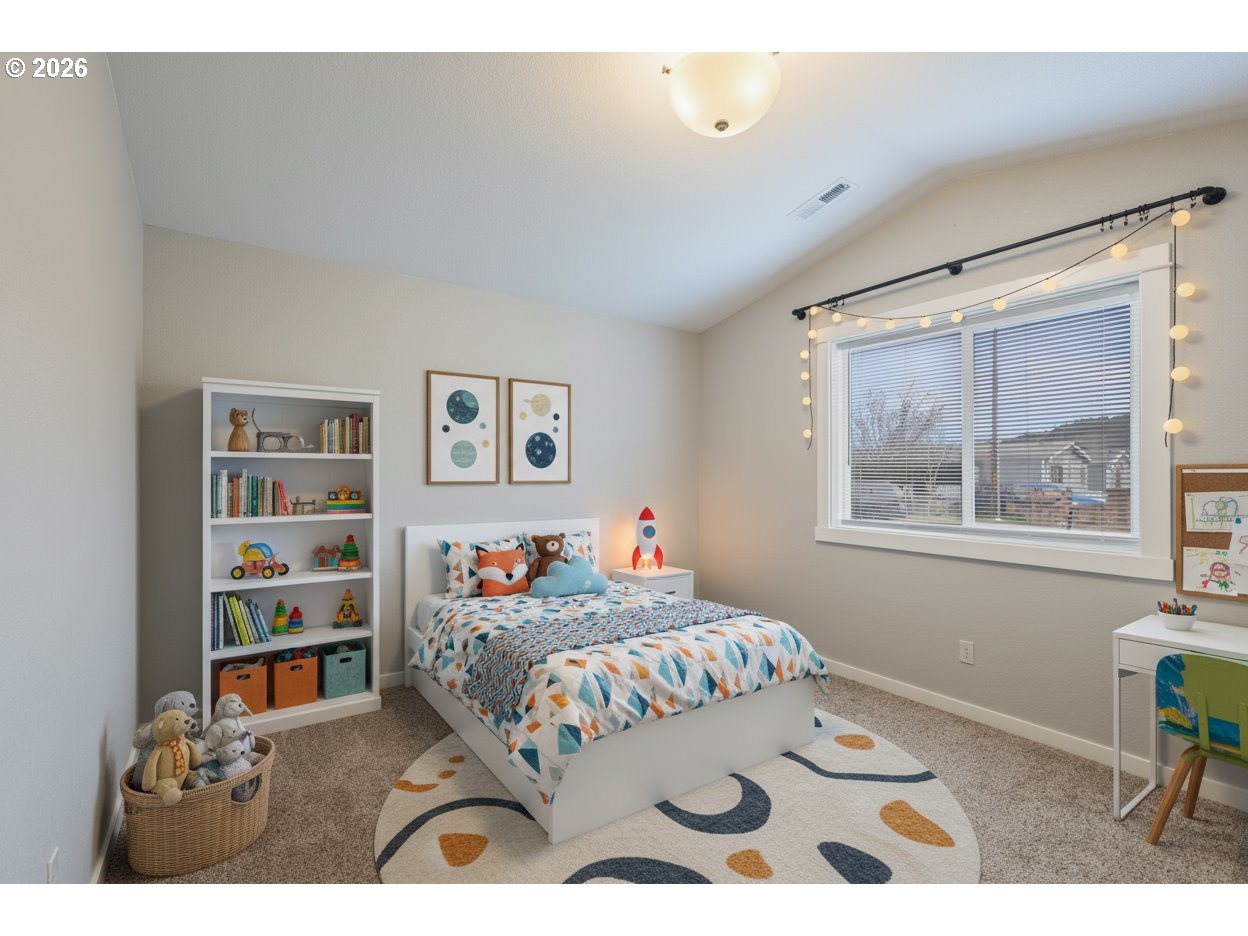409 South State Street Sutherlin, OR 97479 - Photo 31 of 47 a bedroom with a bed a dresser and a window