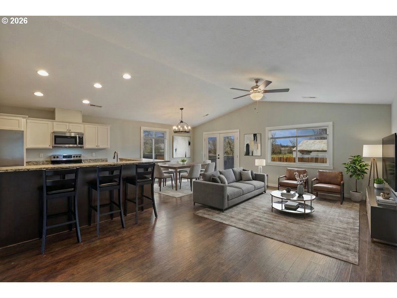 409 South State Street Sutherlin, OR 97479 - Photo 8 of 47 a living room with furniture kitchen view and a chandelier