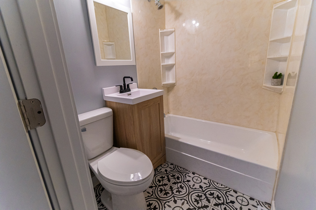 25267 Timber Lane Lake Villa, IL 60046 - Photo 14 of 19 a bathroom with a sink toilet and shower