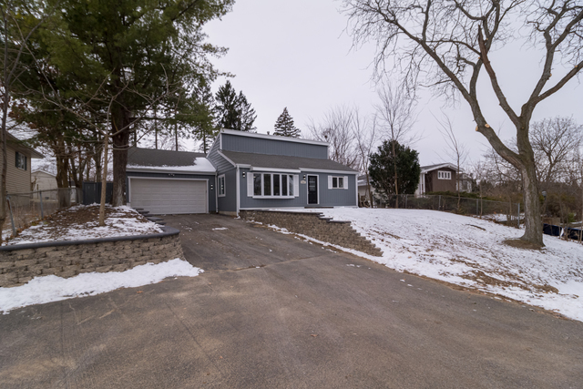 25267 Timber Lane Lake Villa, IL 60046 - Photo 2 of 19 a view of a house with a snow in the yard