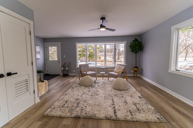 25267 Timber Lane Lake Villa, IL 60046 - Photo 3 of 19 a room with wooden floor and a potted plant