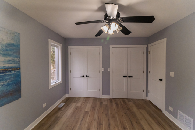 25267 Timber Lane Lake Villa, IL 60046 - Photo 10 of 19 a view of empty room with wooden floor and fan