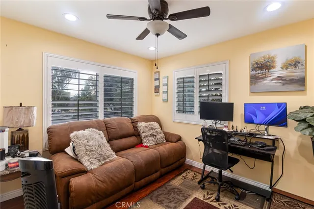 a workspace with furniture and a large window