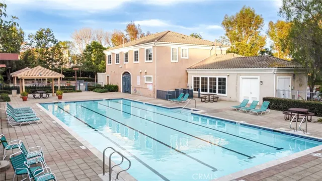 a front view of a house with yard and patio
