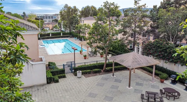 a backyard of a house with table and chairs