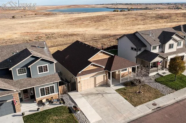 an aerial view of residential houses with outdoor space