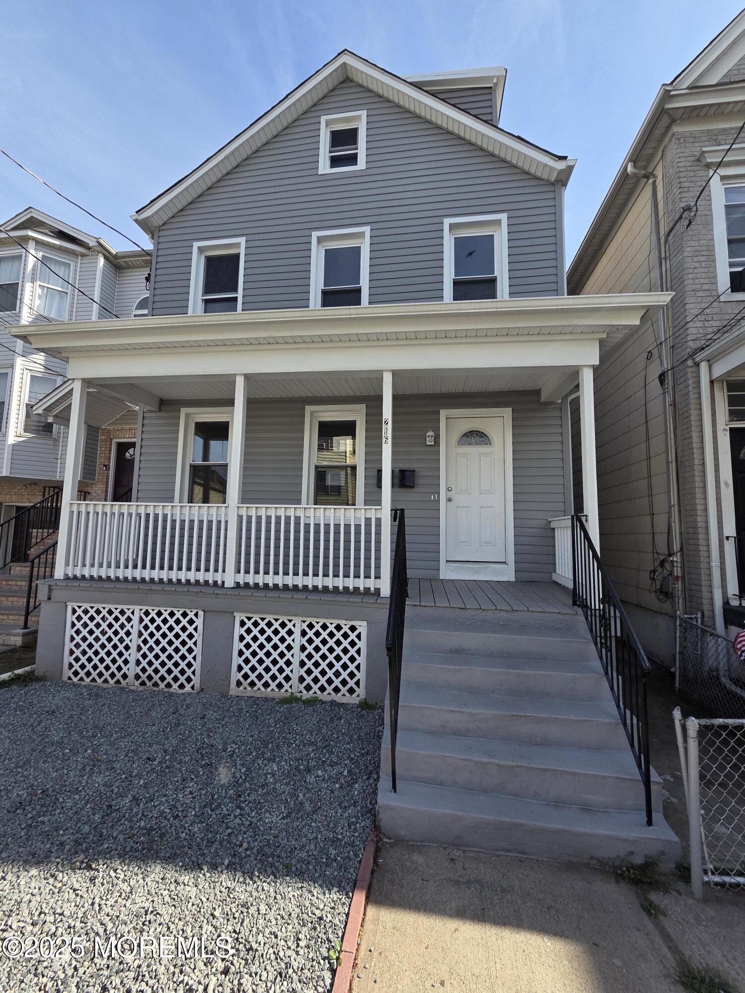 a front view of a house with wooden floor