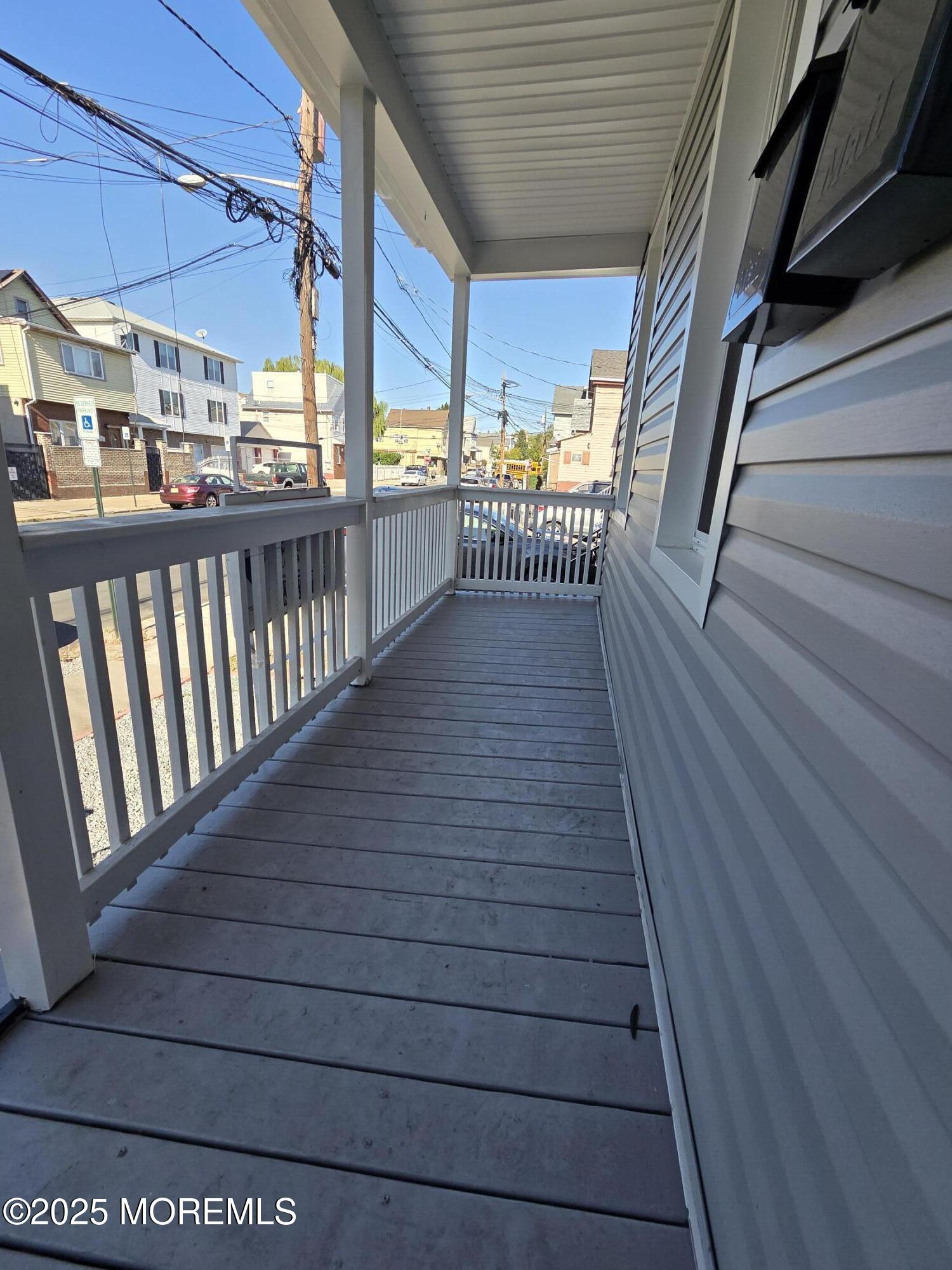 216 Delaware Street Elizabeth Port, NJ 07206 - Photo 2 of 40 a view of a balcony with wooden floor