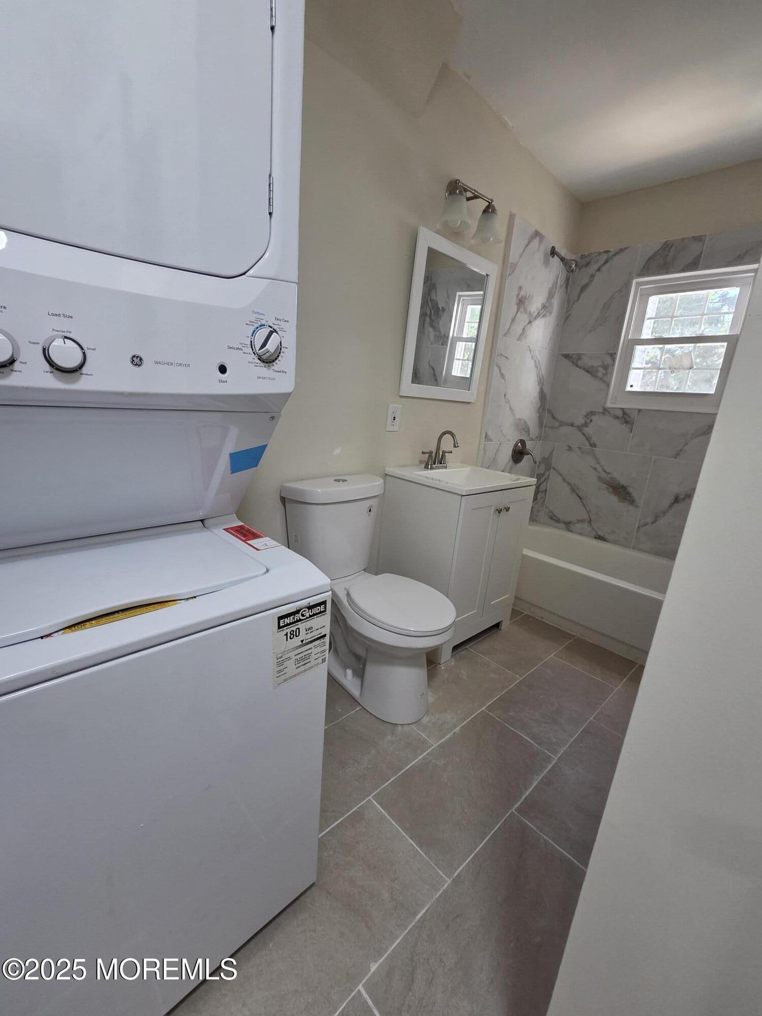 216 Delaware Street Elizabeth Port, NJ 07206 - Photo 27 of 40 a bathroom with a toilet sink and mirror