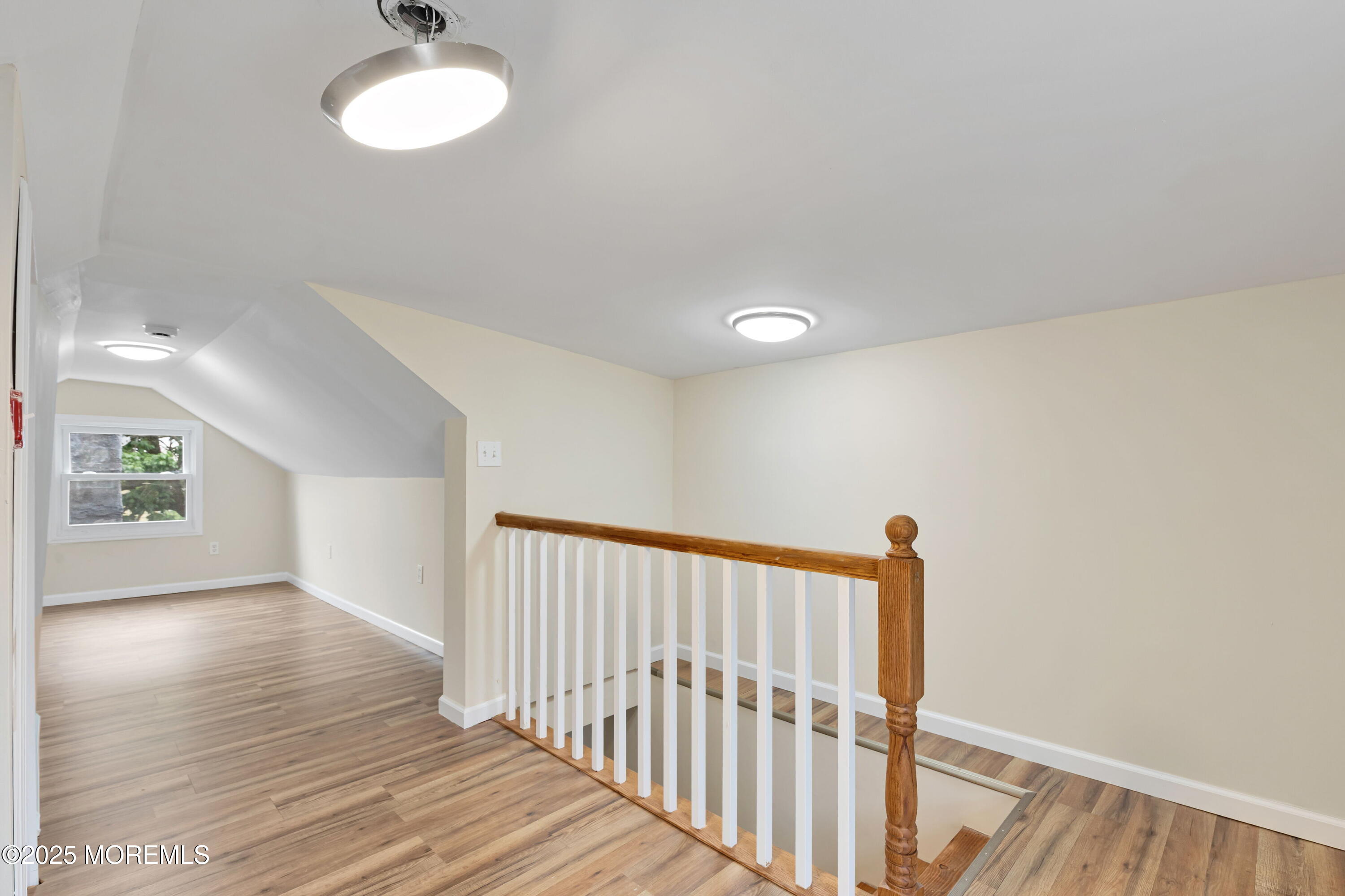 216 Delaware Street Elizabeth Port, NJ 07206 - Photo 31 of 40 a view of a hallway with wooden floor