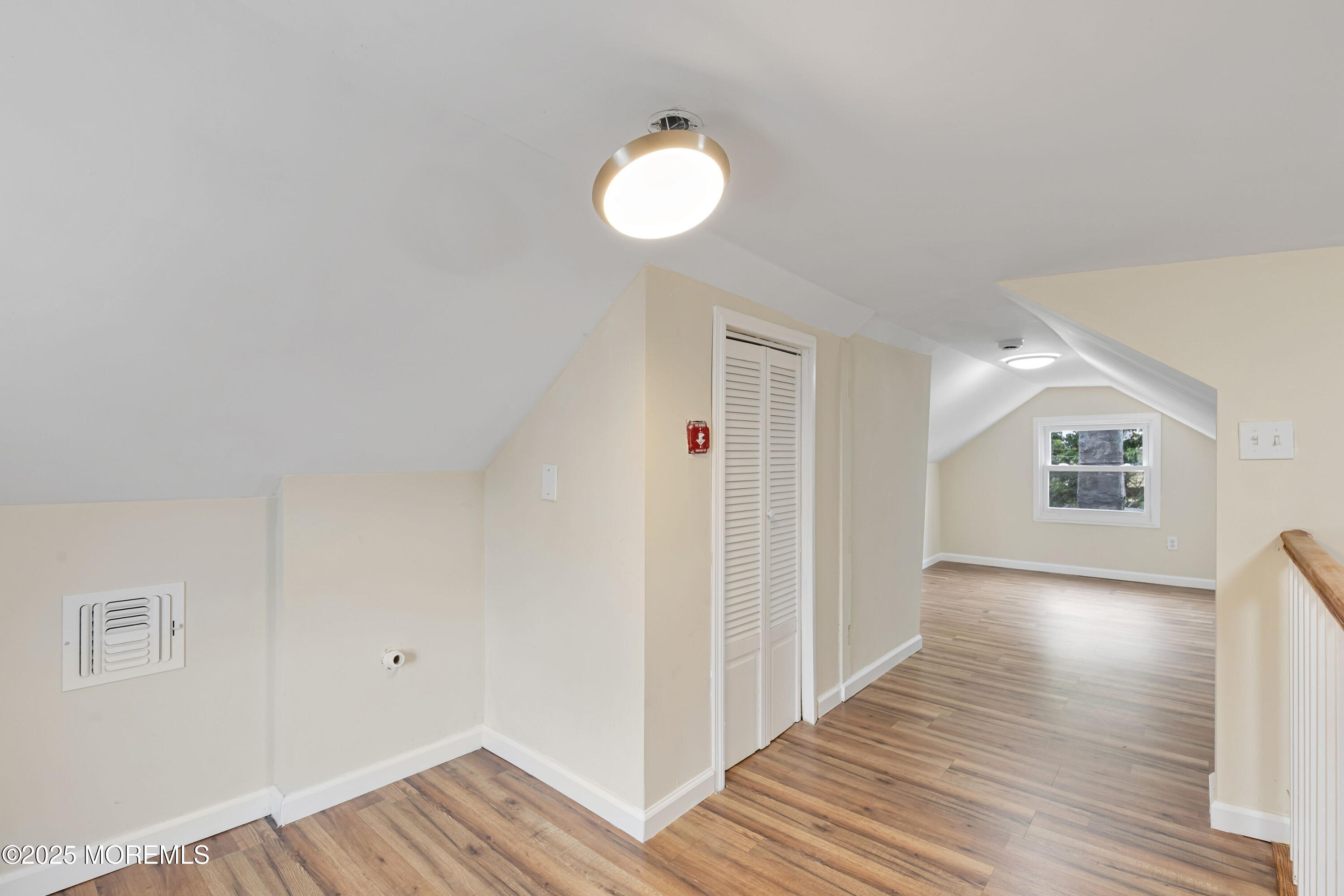 216 Delaware Street Elizabeth Port, NJ 07206 - Photo 35 of 40 a view of a hallway with wooden floor and window