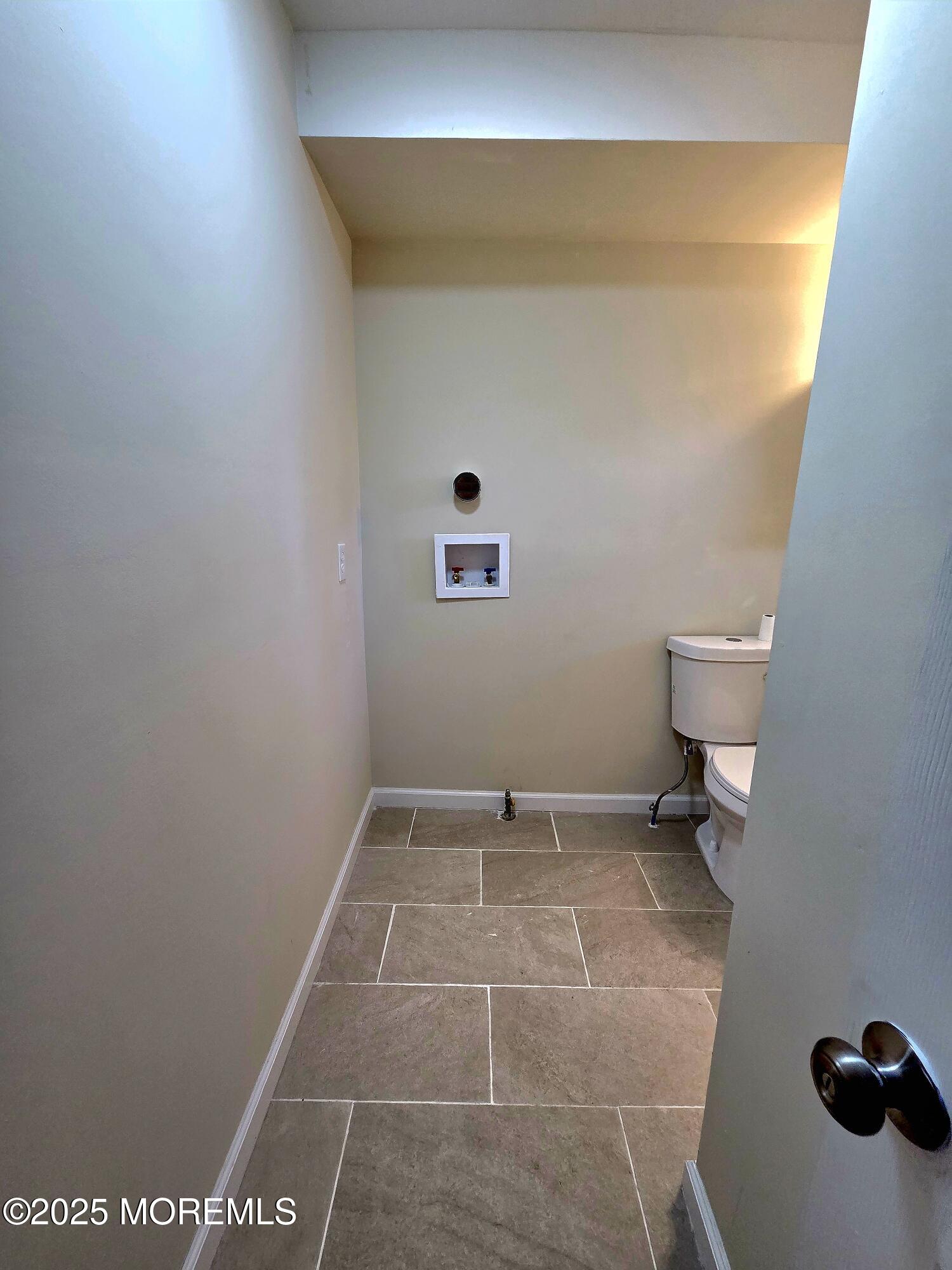 216 Delaware Street Elizabeth Port, NJ 07206 - Photo 10 of 40 a bathroom with a toilet