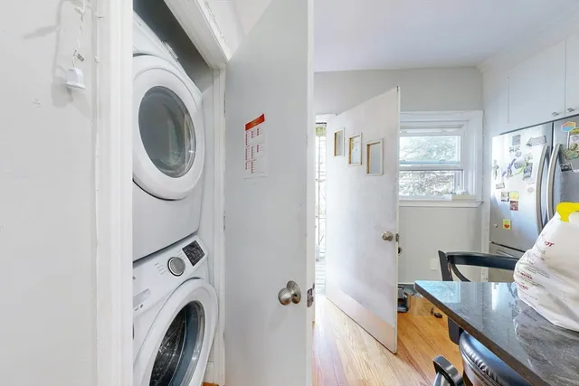 a view of a bedroom with washer and dryer