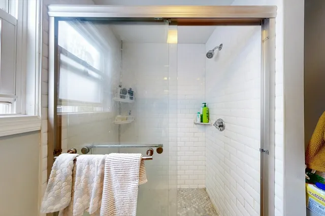 a bathroom with a bathtub and shower