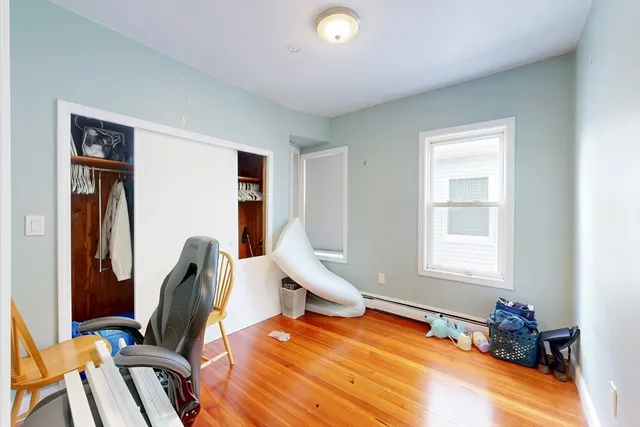 a room with chairs closet and a window