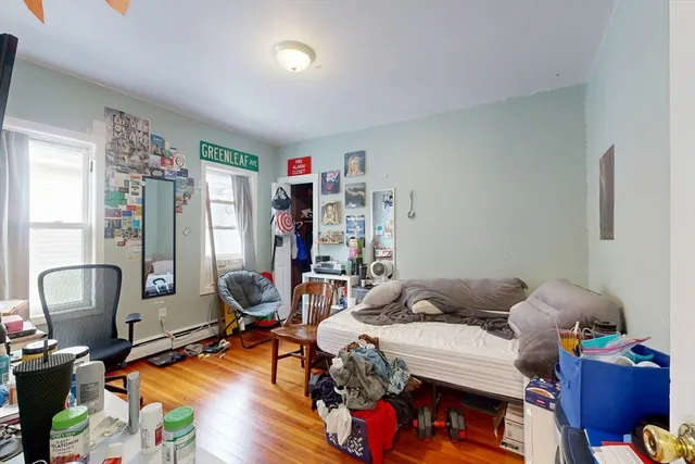 a bedroom with furniture and a window