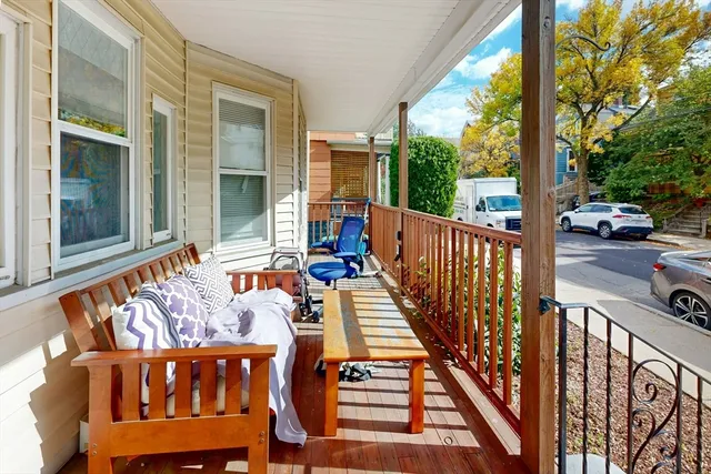 a view of a two chairs with table in balcony