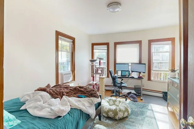 a bedroom with furniture and a window