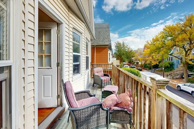 a view of balcony with furniture