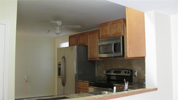 53 Kane Street Springfield, MA 01119 - Photo 5 of 10 a kitchen with a refrigerator and a sink