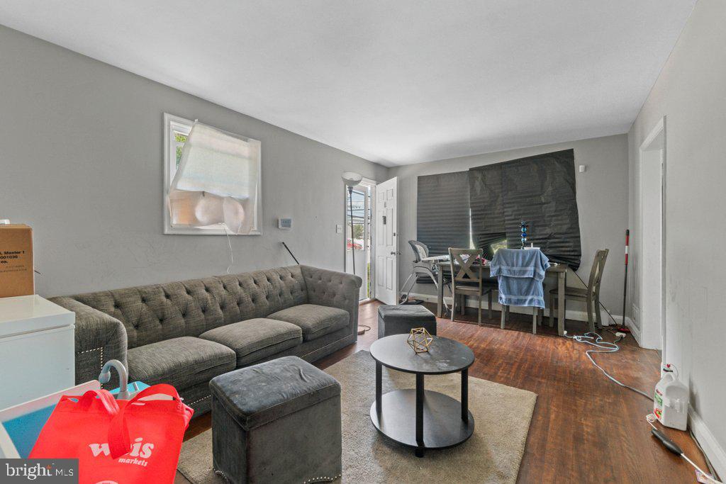 6611 Windsor Mill Road Baltimore, MD 21207 - Photo 3 of 11 a living room with furniture and a window