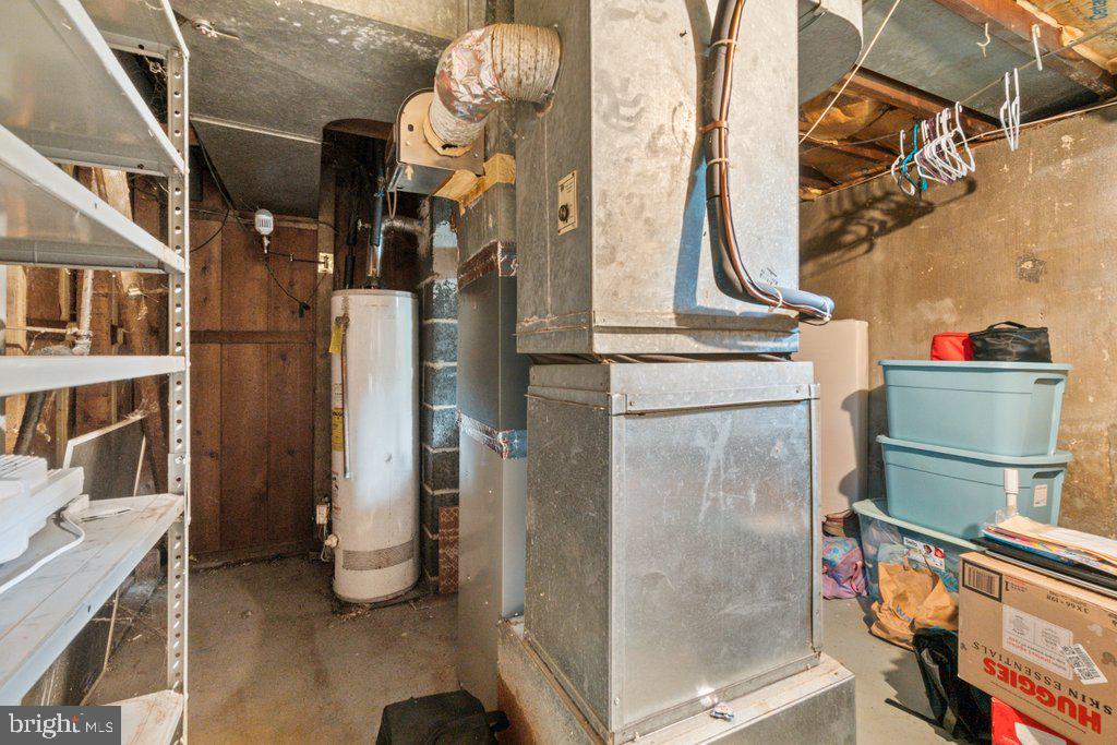 6611 Windsor Mill Road Baltimore, MD 21207 - Photo 7 of 11 a bathroom with a sink and mirror