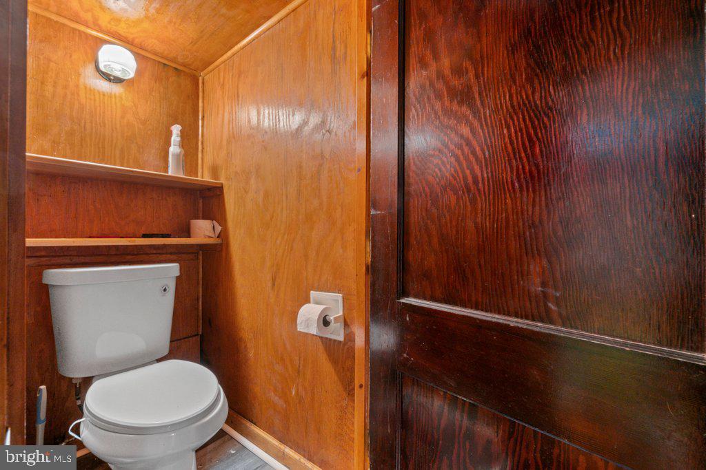 6611 Windsor Mill Road Baltimore, MD 21207 - Photo 8 of 11 a bathroom with a toilet and a shower