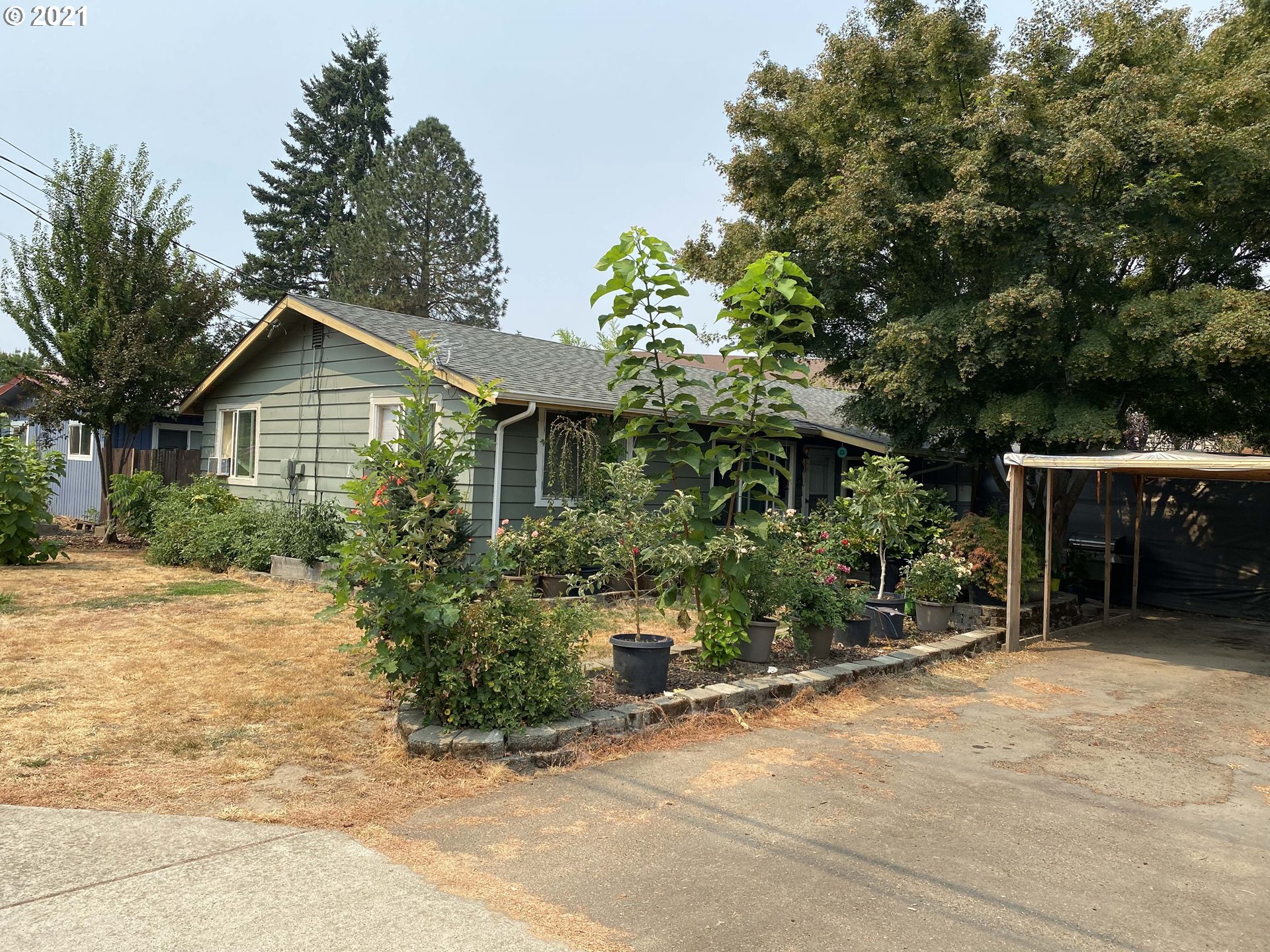 1804 Maple Street Forest Grove, OR 97116 - Photo 2 of 6 a front view of a house with a yard and garage