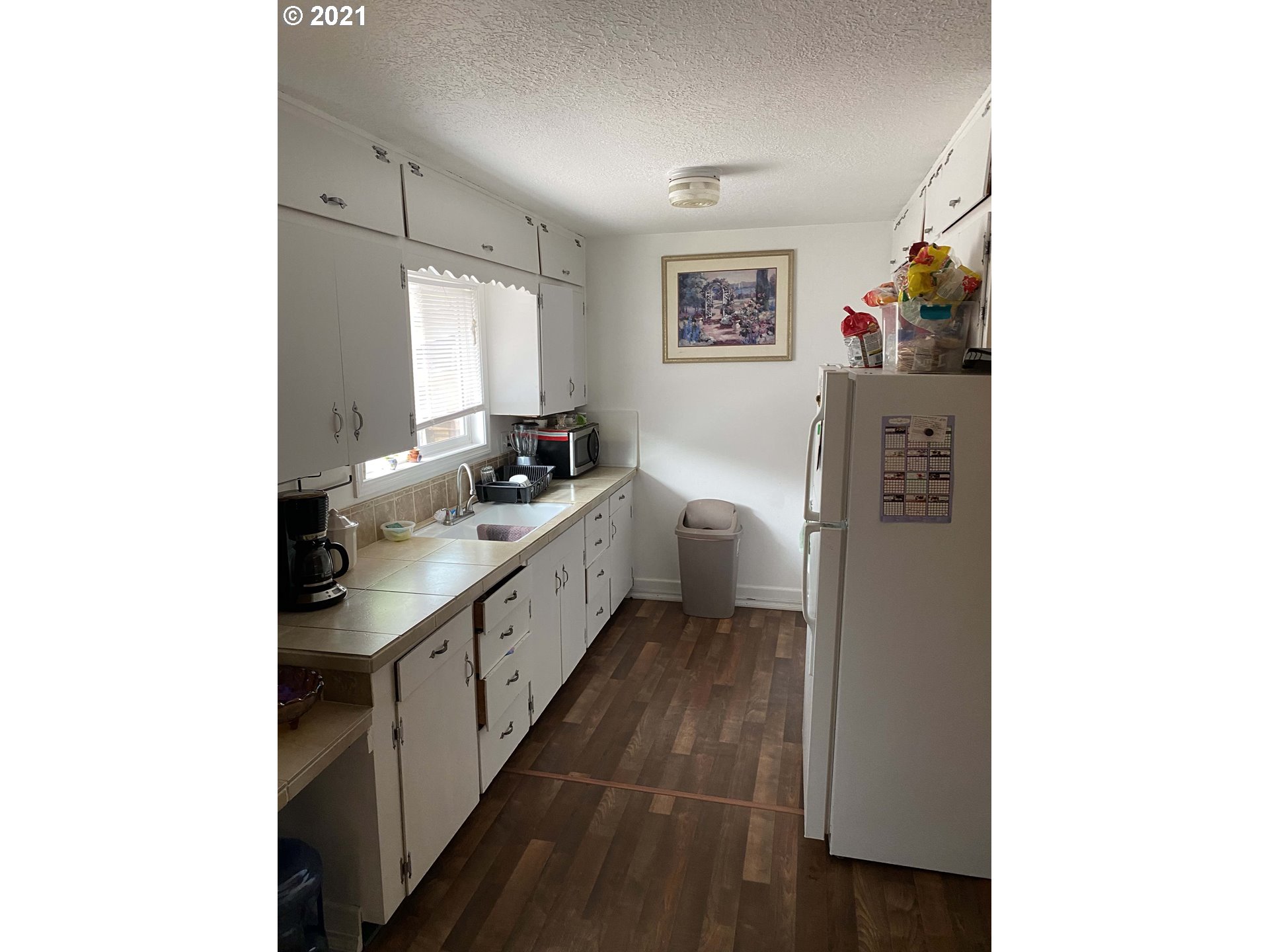 1804 Maple Street Forest Grove, OR 97116 - Photo 5 of 6 a kitchen with stainless steel appliances a sink and a refrigerator