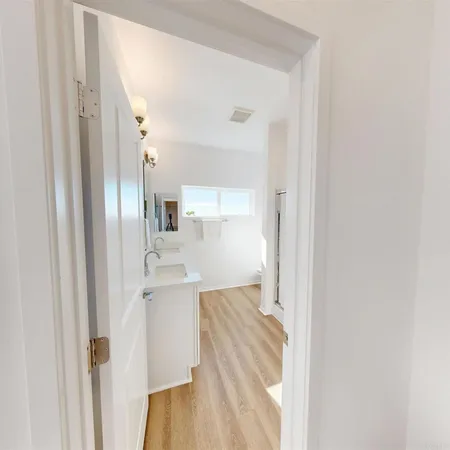 a view of a kitchen from the hallway