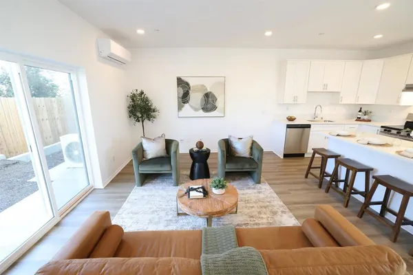 a living room with furniture and a large window