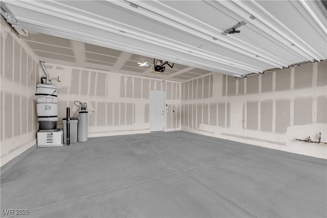 9205 Keystone Ridge Avenue Las Vegas, NV 89148 - Photo 40 of 40 Garage with secured water heater