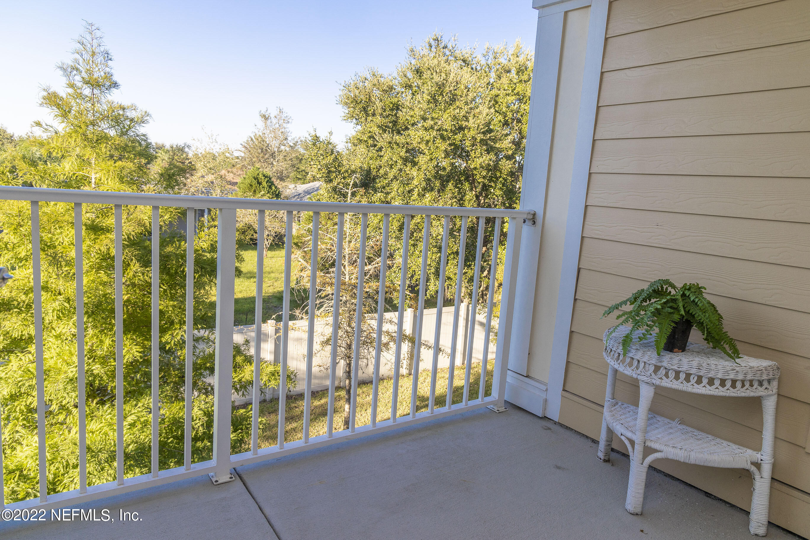 803 Golden Lake Loop St. Augustine, FL 32084 - Photo 13 of 33 a balcony with table and chairs