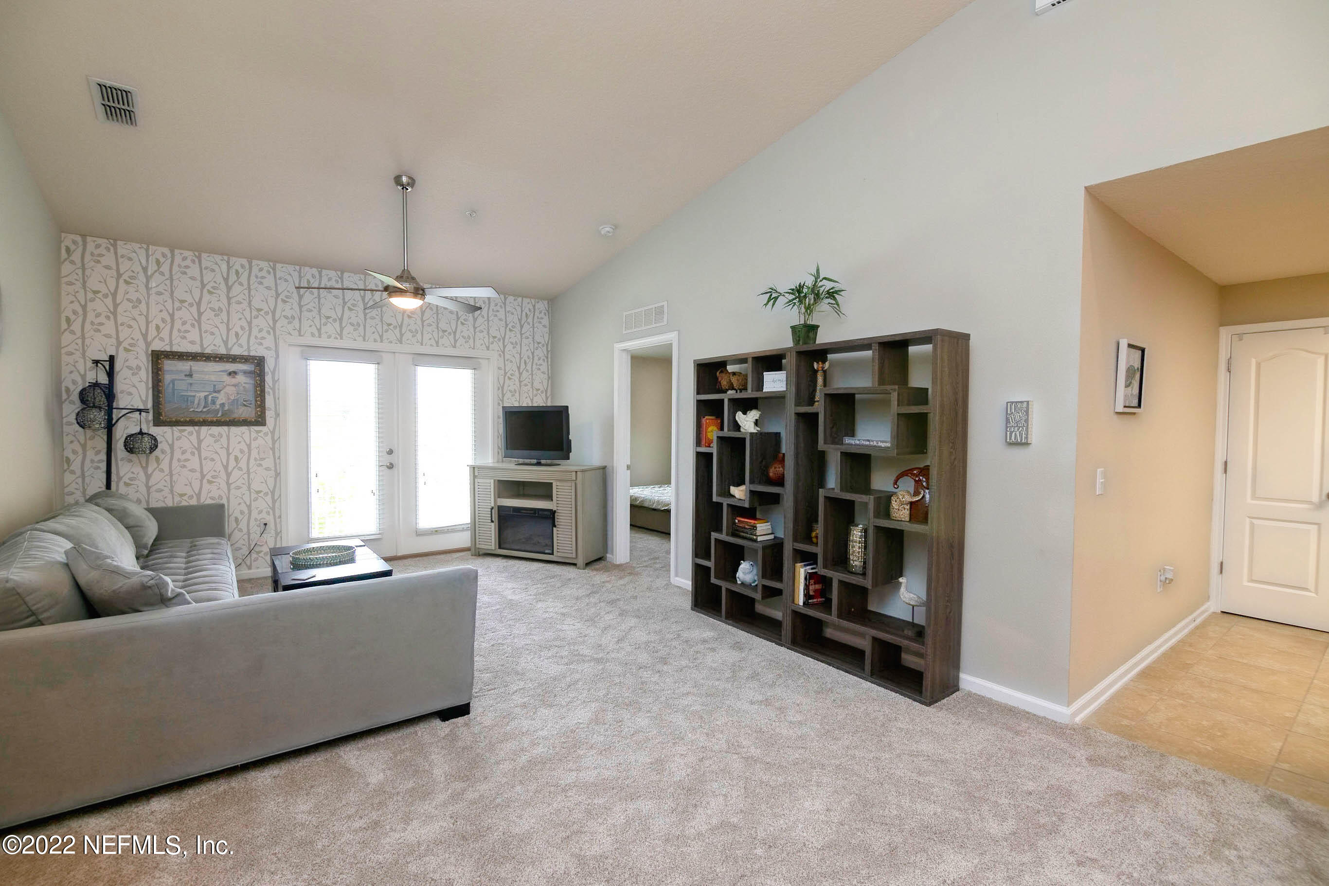 803 Golden Lake Loop St. Augustine, FL 32084 - Photo 14 of 33 a living room with furniture and wooden floor