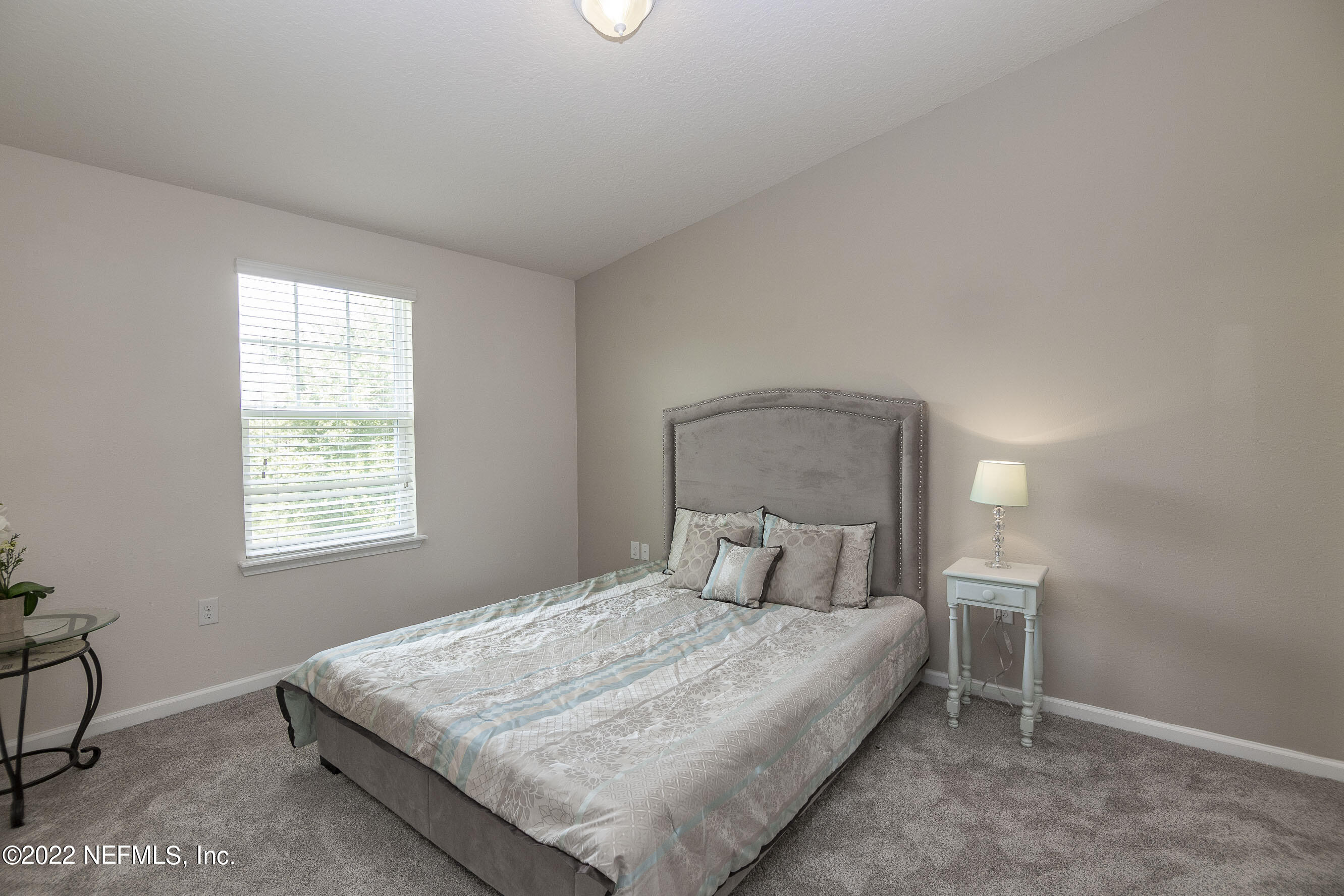 803 Golden Lake Loop St. Augustine, FL 32084 - Photo 15 of 33 a bedroom with a bed and a window
