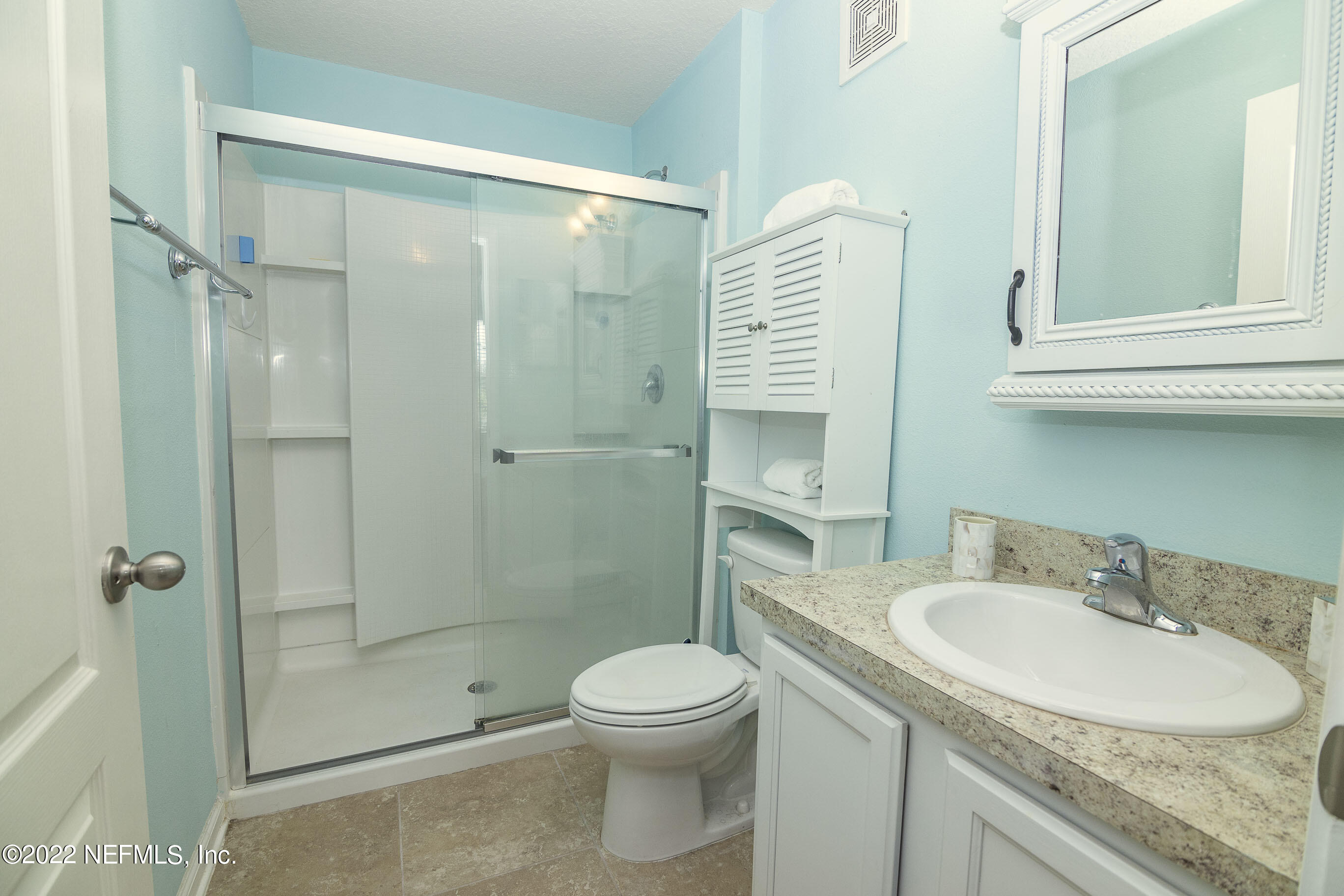 803 Golden Lake Loop St. Augustine, FL 32084 - Photo 18 of 33 a bathroom with a sink toilet and shower