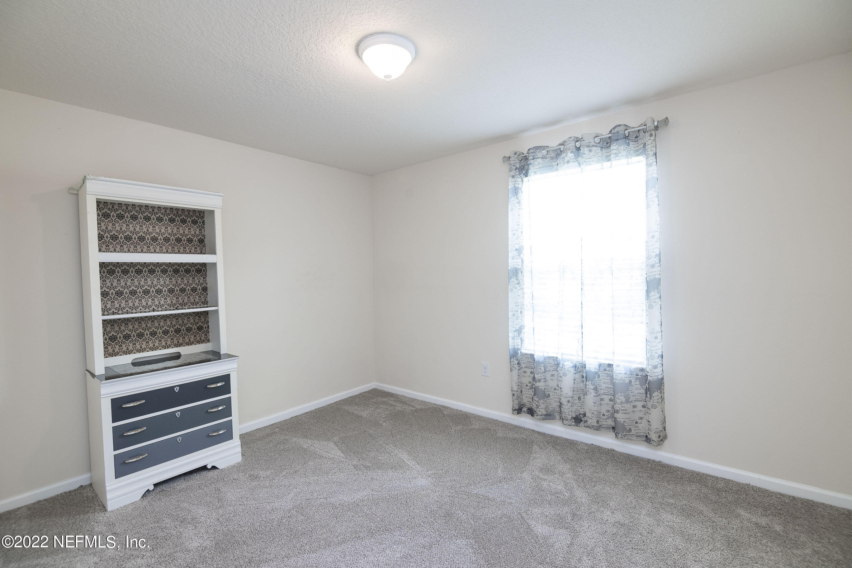 803 Golden Lake Loop St. Augustine, FL 32084 - Photo 19 of 33 a view of room with stairs and windows